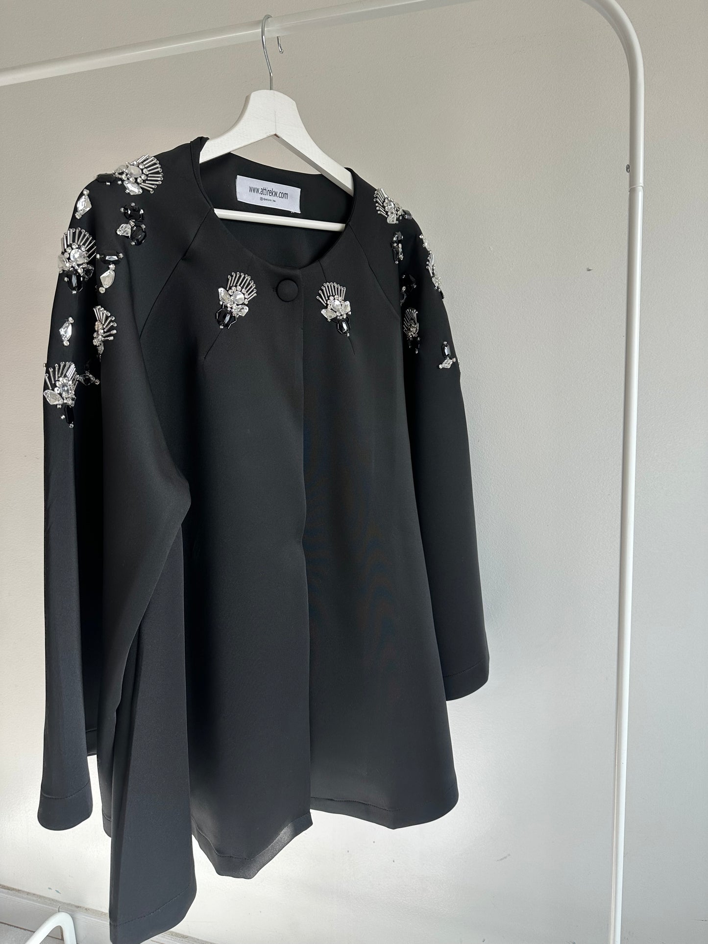 Black and embillished cape
